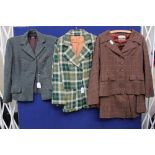 A late 1940's brown checked skirt suit with cape attached, a 1950's green flecked wool jacket,