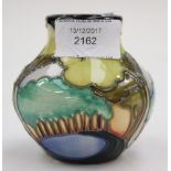 A Moorcroft first quality squat vase in the 'Eventide' pattern in an unusual colourway,