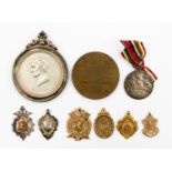 Collection of watch fobs and medallions comprising four 9ct gold fobs with a combined total gross