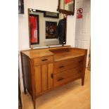 A 1950s teak sideboard