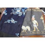 A hand painted Asian panel, black ground, together with a dark blue ground,