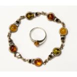 An amber and silver bracelet ( three colour) a silver and amber ring