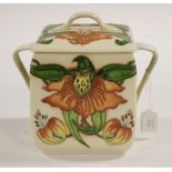 A Moorcroft biscuit box and cover June 2017 made for flower festival,