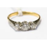 A diamond three stone 18ct gold ring, with a total diamond weight approx 0.