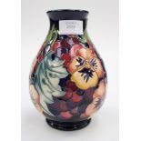 A Moorcroft first quality vase in the 'Fruit Feast' pattern, designed by and signed by Emma Bossons,