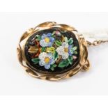 A micro mosaic floral brooch with yellow metal surround, probably 9ct gold,