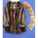 A short dark brown Mink jacket, re-modelled (1987) valued at £1750,