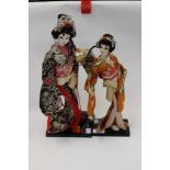 A Kabuki princess, Yaegati, carrying a shotgun helmet, on original plinth, approx 41cms high,