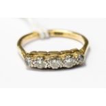 A diamond five stone 18ct gold ring, size L,