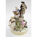 A large Meissen figure group with people dancing and playing instruments,