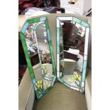 A pair of mirrors with painted glass rims with floral decoration (2)