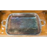 A late 19th Century silver on copper, two handled tray,