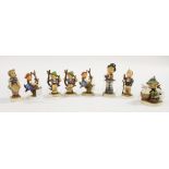 Hummel figurines, eight in total, one has restoration and three have minor chips,
