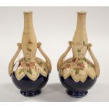 A pair of bottle vases with twin handles, enamel foliate - passion flowers,
