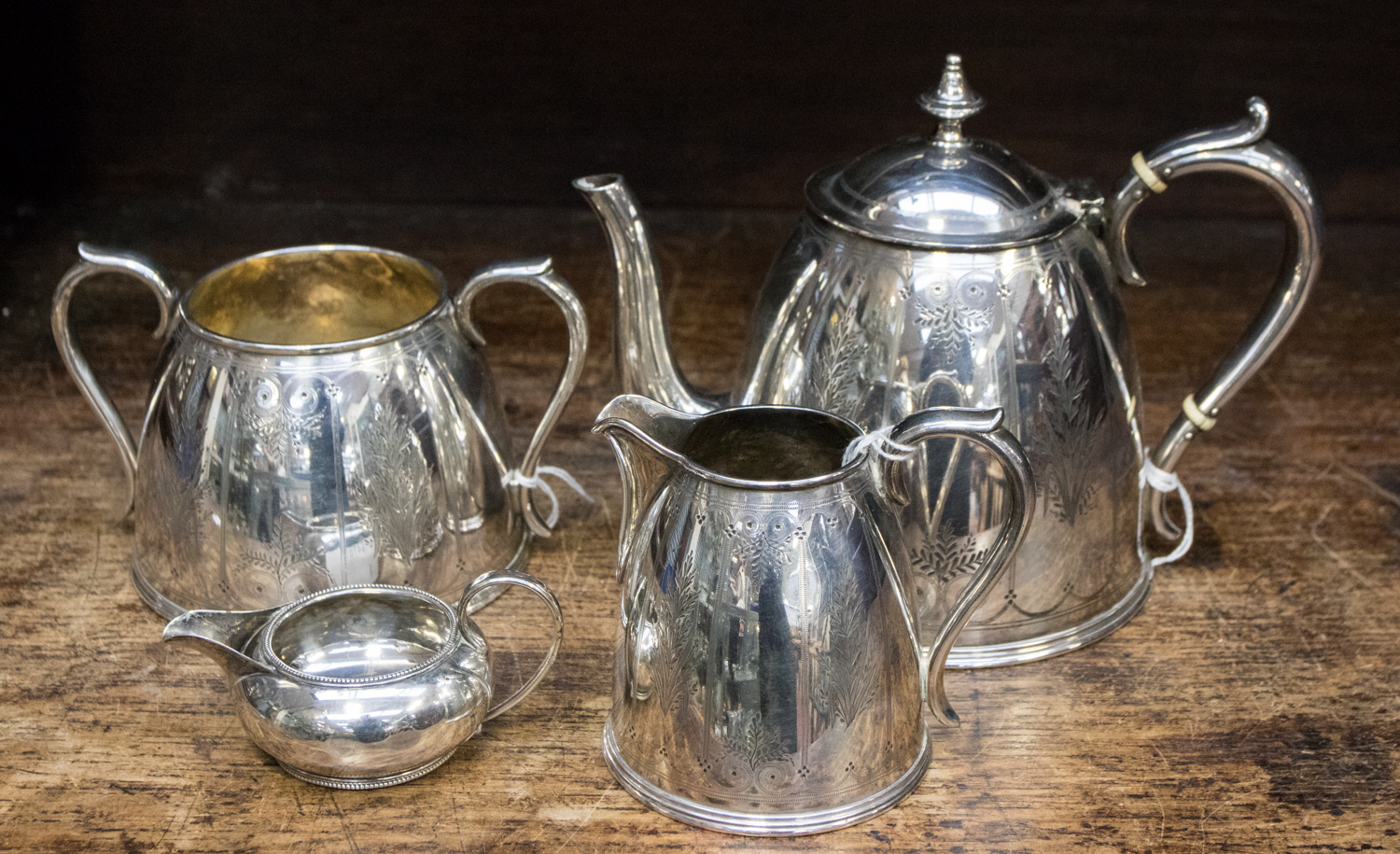 A Victorian Elkington and Co teapot and sugar bowl, plus silver cream jug,