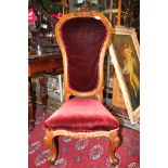 A mid Victorian walnut high backed drawing room chair, with upholstered seat and back,