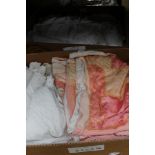 Two boxes of Christening gowns, table linen, cot quilt, etc, including hand crochet work,