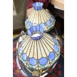 A pair of Tiffany style pendant light shades, in blue,