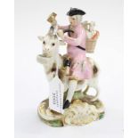An early Derby figure of man riding a goat,