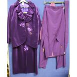 A selection of purple items to include a skirt with pointed design at the back with brass cones,