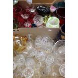 A collection of Cranberry glassware to include a jug and wine glasses,