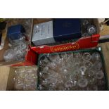 A large collection of cut glass including drinking glasses, decanters, vases,