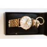 A 9ct gold Garrard wristwatch with batons and champagne dial,