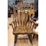 A 20th Century American style beech rocking chair