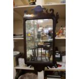 A George III mahogany fretwork mirror,
