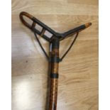 A vintage bamboo and brass shooting stick