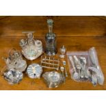 An EPNS four piece cruet set, together with a similar three piece cruet set,