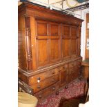 An early Victorian oak housekeepers cupboard