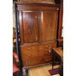 A George III mahogany linen press, the cornice with plain dentil moulding,