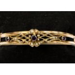 A 9ct gold, pearl and amethyst Edwardian bangle,