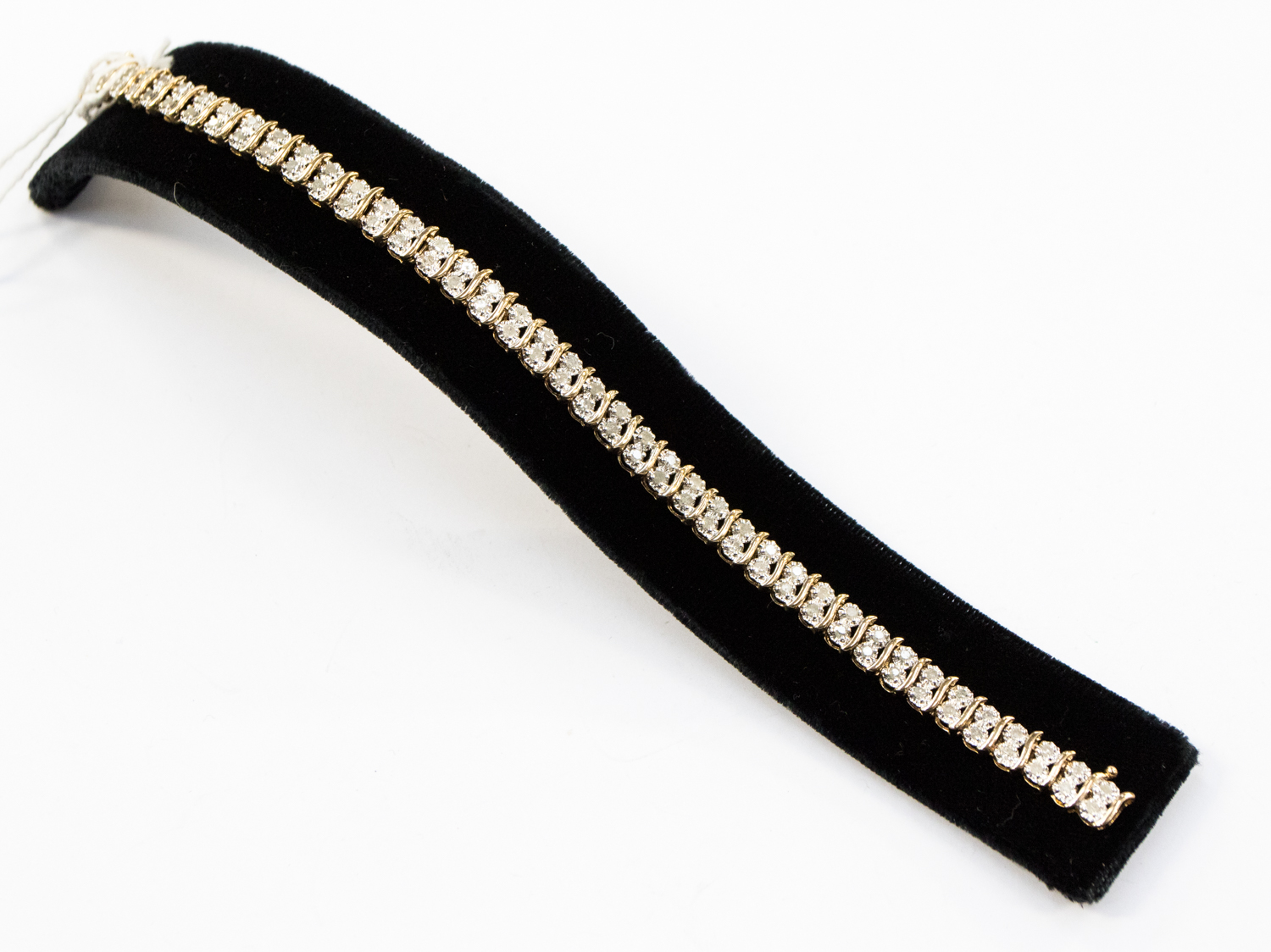 A 9ct diamond bracelet having forty one pairs of brilliant diamonds in articulated links,
