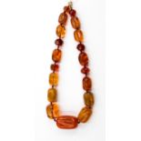 An amber necklace graduating beads (note some clarified treaded beads)