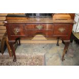 A George II oak lowboy, fitted with three drawers, cabriole legs, circa 1750, 80cm high, 102cm wide,