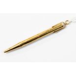 An eighteen carat gold, cased propelling pencil with loop attachments, reg.