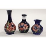 Three Moorcroft small vases, anemone pattern, blue ground, stamped 'Moorcroft' to base,