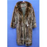 A dark brown full length Mink coat, button detail on sleeves, very interesting lining design,