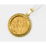 A half Sovereign pendant in a 9ct gold mount, coin dated 1910, approx 5.