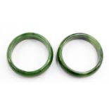 Two spinach and jade bangles,