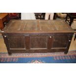 A 17th Century oak joined chest, three panelled front,