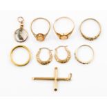 A collection of five 9ct gold rings, a rose gold pendant, a cross and earrings, approx 13.