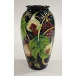 A Fig and Peach pattern dark blue ground baluster Moorcroft vase,