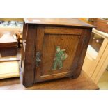 An oak smokers cabinet with internal drawers with image of Dutch boy to front (1)