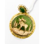 A 10ct gold North American Moose/Elk pendant with jade type stone, gross weight 9.