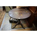 A George III tripod tilt top table