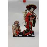 Kabuki Princess Fuji Musume, Wysteria, with a child carrying wysteria, both on original plinths,