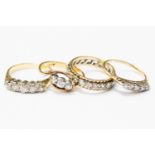 Three diamond rings in 18ct gold, comprising one three stone cross over ring,